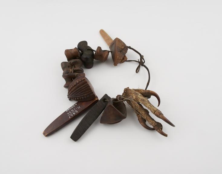 Bones, horn, birds claw threaded onto leather thong