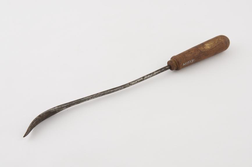 Firing iron(?), steel and wood, probably British, 195th century