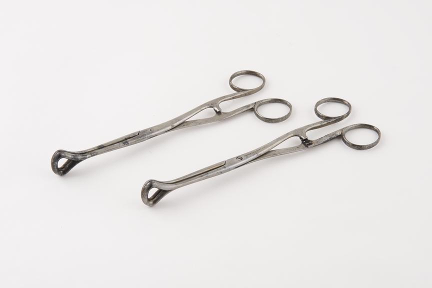 Two forceps, application unknown, steel, by Skidmore, Sheffield