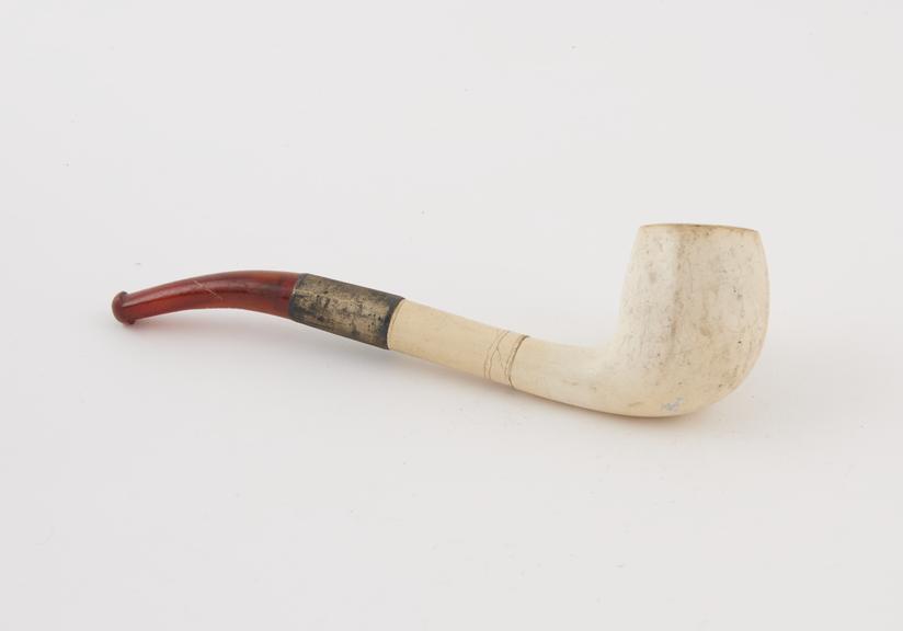 Meerschaum tobacco pipe with amber mouthpiece and carving of