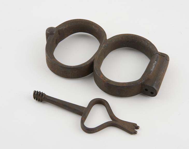 Handcuffs, iron, with key, by Griffin, English, 1750-1850