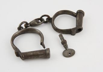 Handcuffs, key alongside