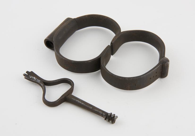 Handcuffs, iron, with bolt lock, English, 18th century