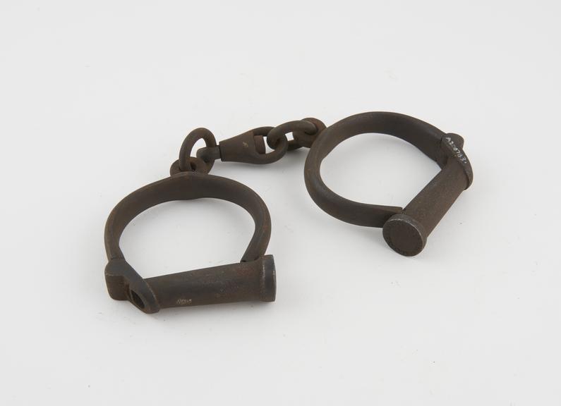 Pair of handcuffs, iron, by Hiatt, English, 19th century