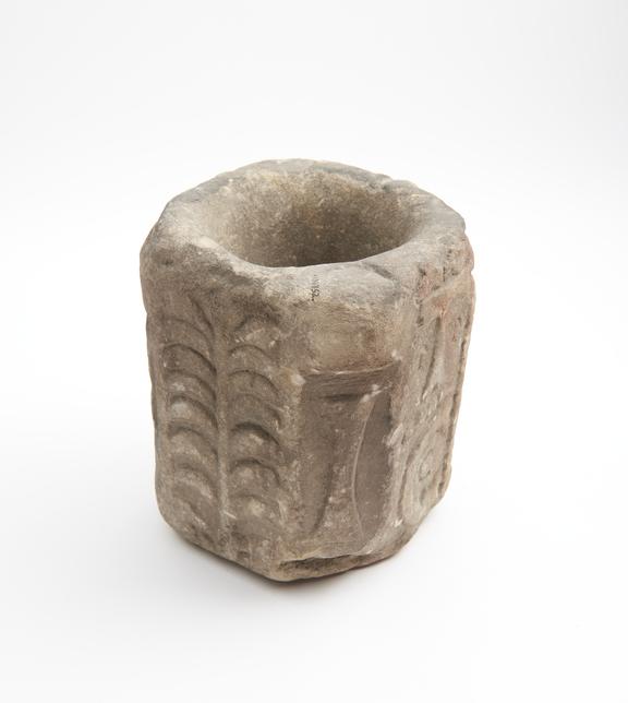 Roughly octagonal stone mortar, with two lugs