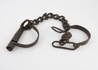 Leg irons, pair, for prisoner, with padlock