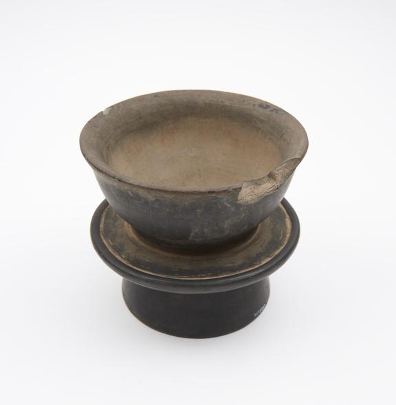 Double ended black pottery mortar, unglazed