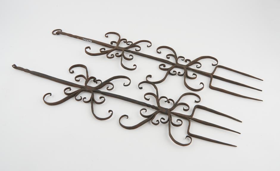 Pair of wrought iron toasting forks, tridents