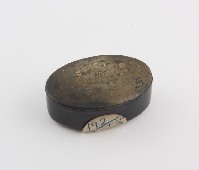 Papier mache snuff box, japanned finish, oval in section