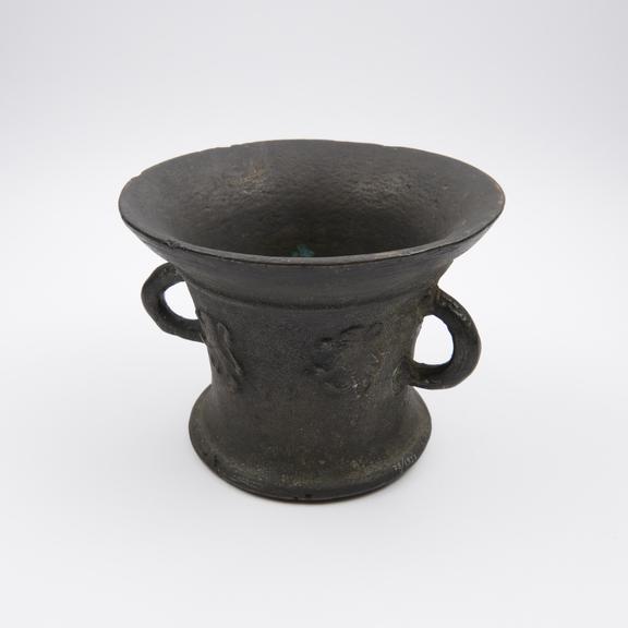 Bell shaped mortar, wide flaring rim, flaring foot, flat base