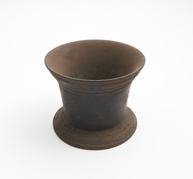 Small iron mortar, slightly flared and mauded rim