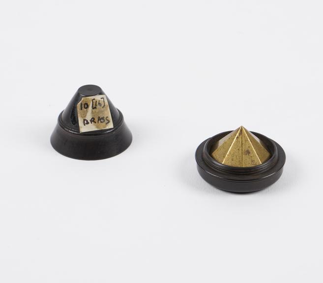 Brass geometric shape with Ebony case, label on case marked