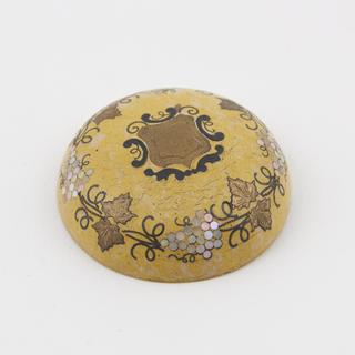 Sample of yellow Parkesine, inlaid with brass and nacre