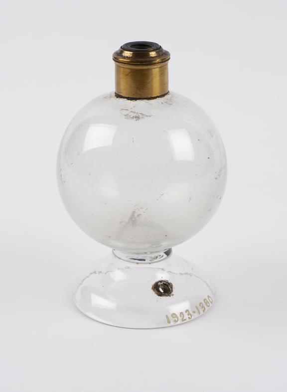 Small glass globe, on a glass stand with a brass collar