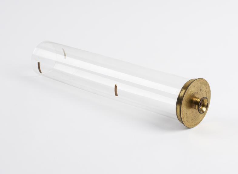 Glass cylinder; brass base; milled screw