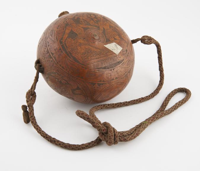 Round water bottle made from a gourd, long cord, cork stopper