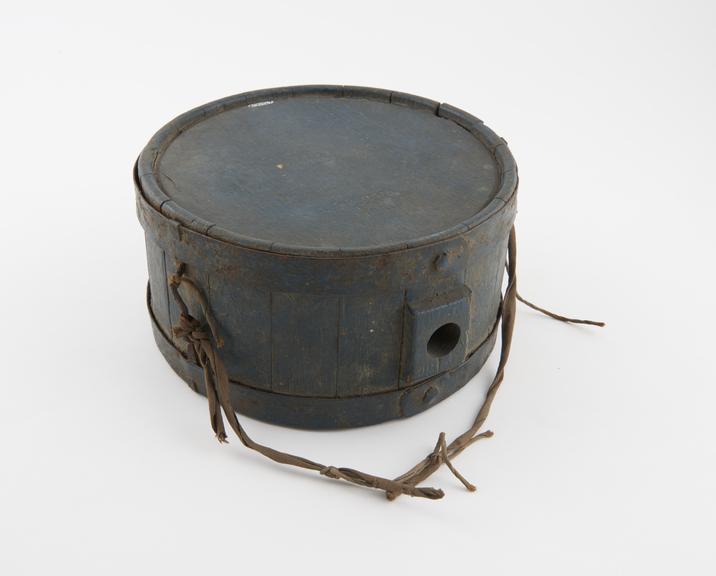 Wooden water bottle in the shape of a drum, for military use