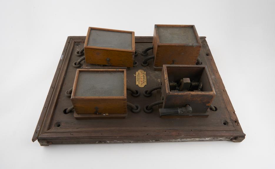 Rectangular wooden frame with two heavy duty switches and two