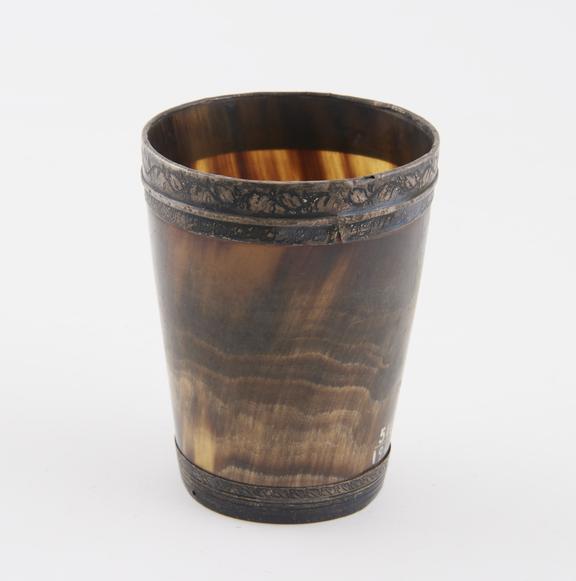 Horn tumbler with engraved rim top and base