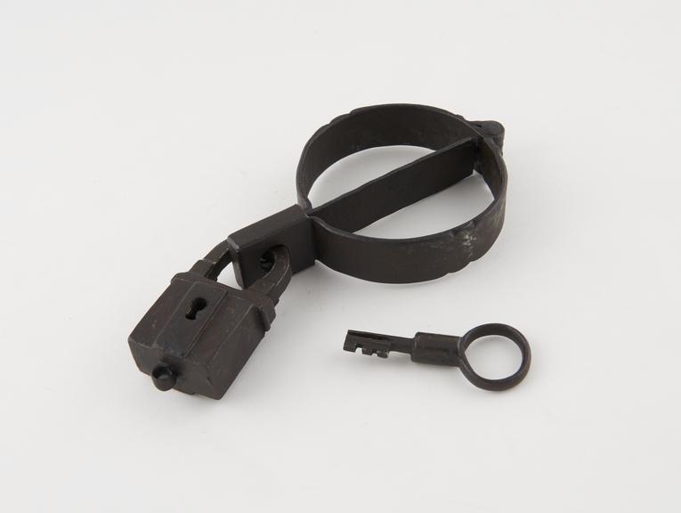 Handcuffs with slave lock and padlock, iron, probably English