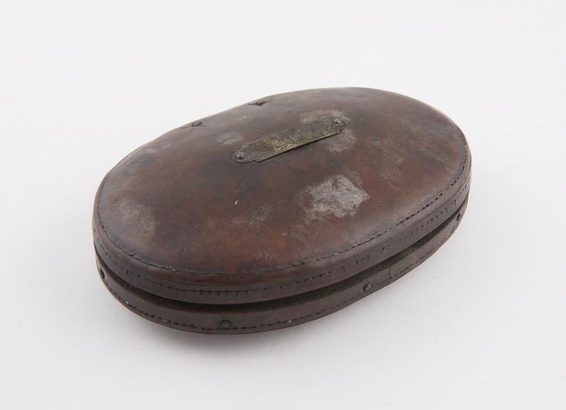 Cigar case, oval, leather, with silver roller pin hinge at back