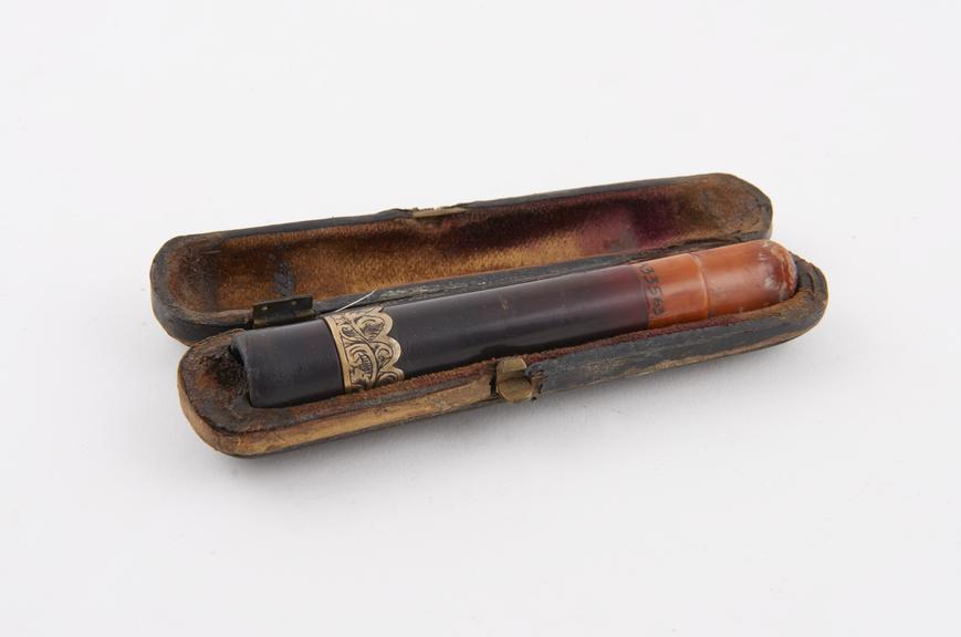 Cigar holder, amber, with engraved gold band in case