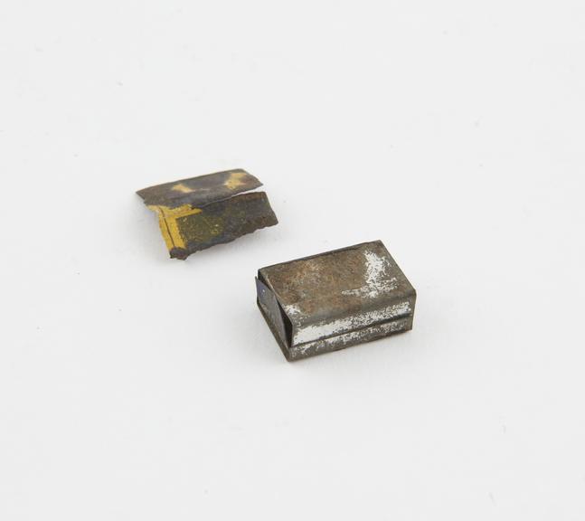 Miniature tin matchbox with open ended cover and sliding inner