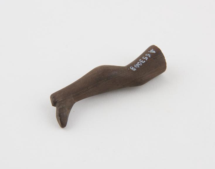 Wooden tobacco pipe tamper in the form of a left leg, English