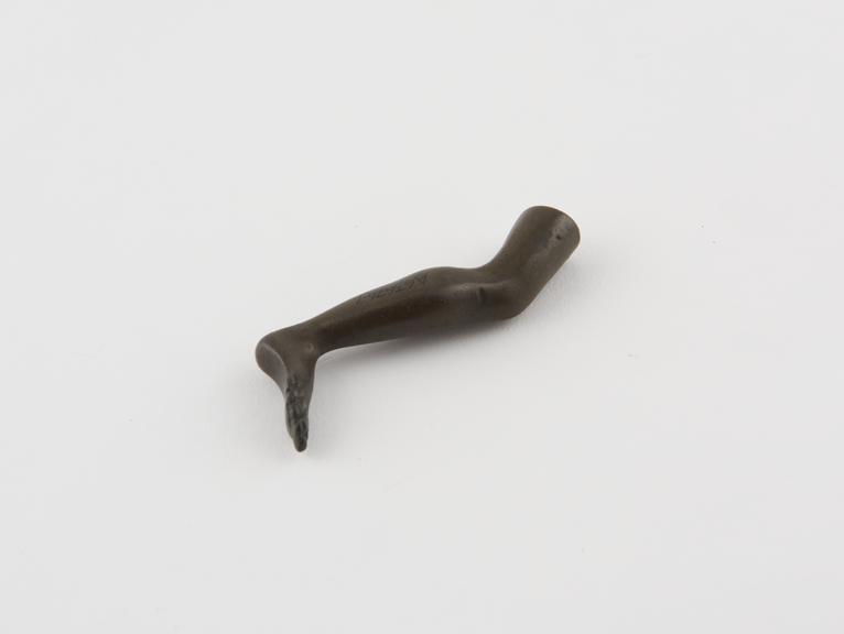 Bronze pipe tamper in form of human leg, English or French