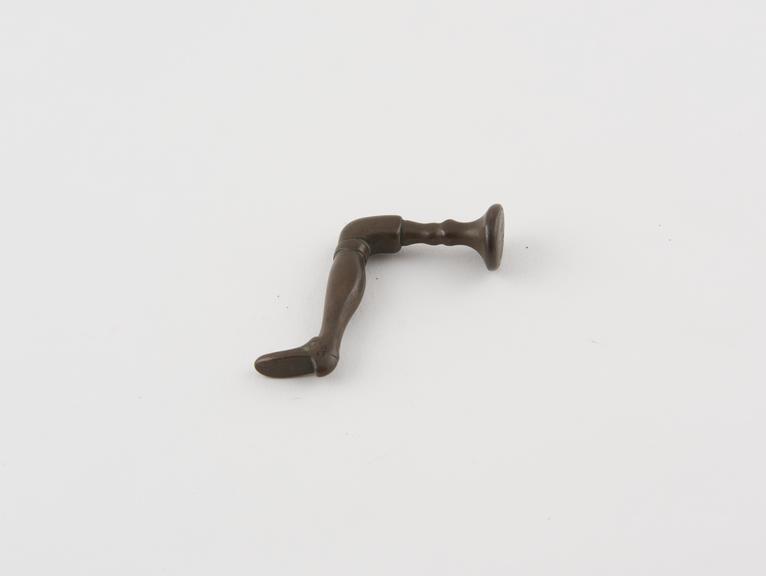 Copper or bronze pipe tamper in form of human leg