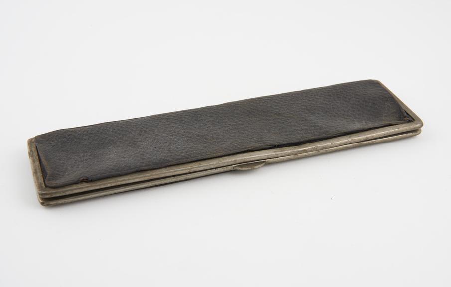 Flat black leather case, probably for cigars, oblong