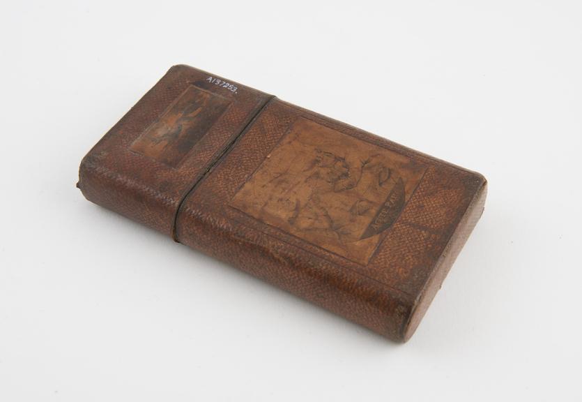 Leather cigar case in the form of a carton with sliding lid