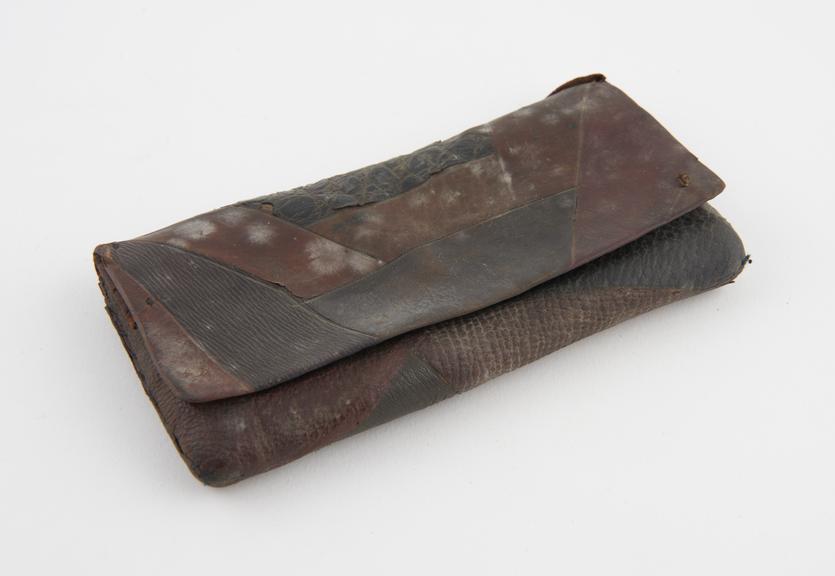 Leather tobacco pouch made of different types of leather strips