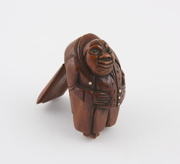 Wooden snuff box in the form of an old man with a long outer