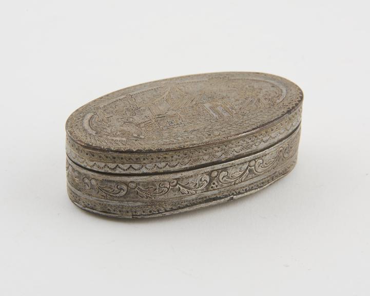 Silvered brass oval shaped snuff box, hinged lid, at the back