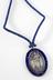 Metal pendent badge with blue silk cord for an S.C.M