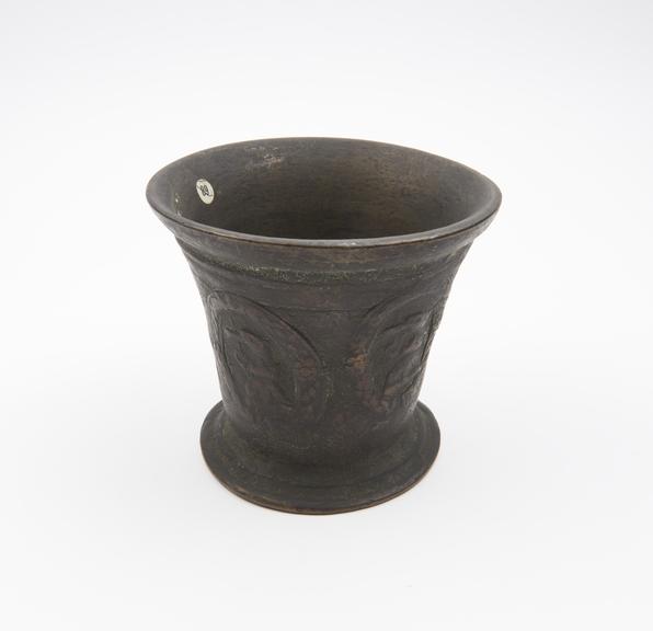 Bell-shaped bronze mortar, slightly flared rim