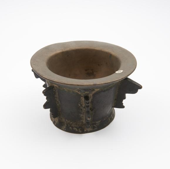 Tall bronze mortar with flat out-turned base and flaring rim