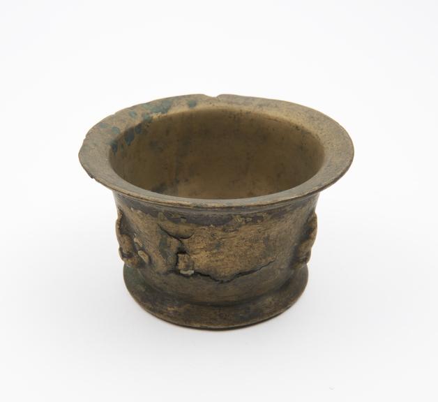 Small squat bronze mortar, flared rim and foot, flat base