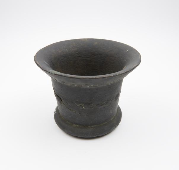 Bronze bell-shaped mortar with moulded foot ring and flared rim