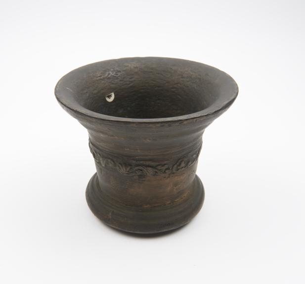 Bronze bell-shaped mortar with flared rim