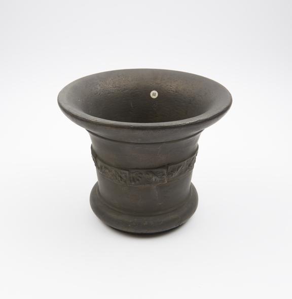 Bronze bell-shaped mortar with moulded foot ring and flared rim