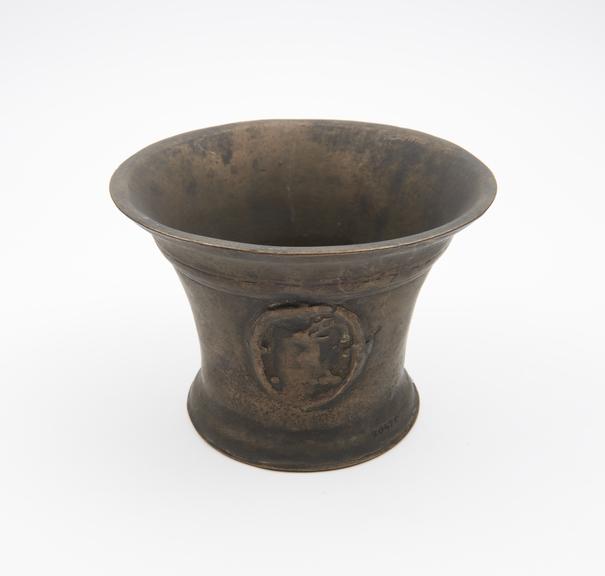 Bell-shaped mortar, deep flared rim, flat base, flared foot