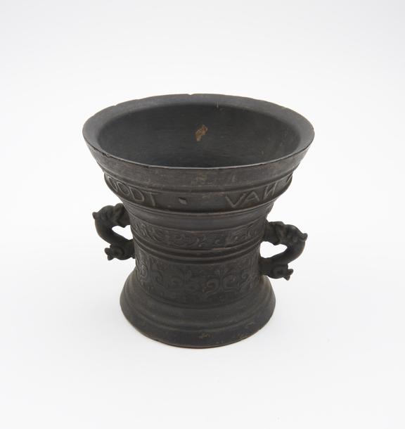 Two handled small bell shaped bronze mortar, everted rim