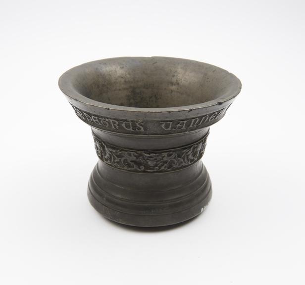 Small bell shaped mortar, moulded rim and foot