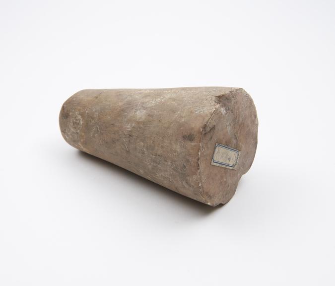 Conical stone pounder with flat pounding end and rounded tip