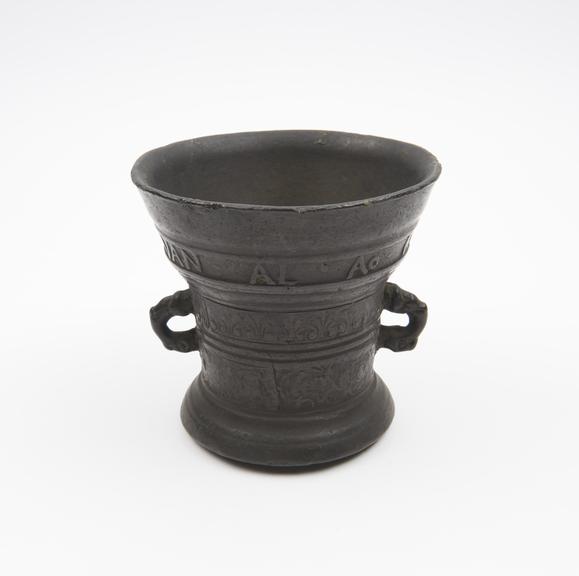 Small bronze bell shaped mortar, flared rim and foot, flat base