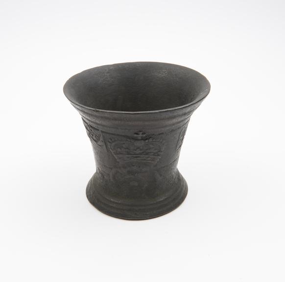 Bronze bell-shaped mortar with rose-and-crown motifs, English