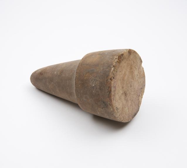 Cylindrical stone pounder with conical grip, possibly European