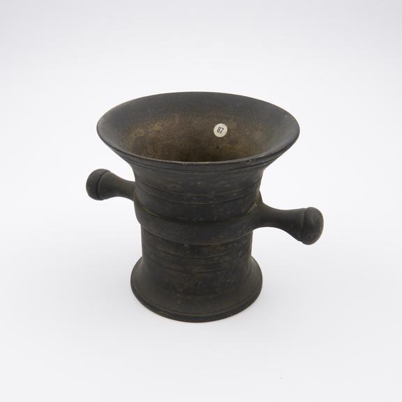 Tall, thin bronze mortar, wide flaring rim